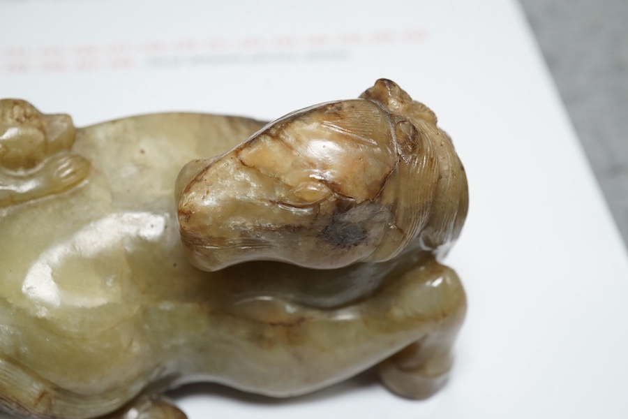 A Chinese celadon and mottled brown jade figure of a monkey climbing on a recumbent horse, Ming dynasty, 16th-17th century